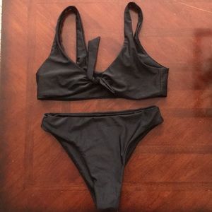 Black swim suit. Size medium. Never worn.